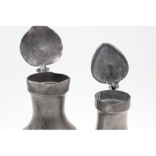 1174 - TWO MID-LATE 19TH CENTURY FRENCH PEWTER LIDDED MEASURES. of double and single litre size, the talles... 