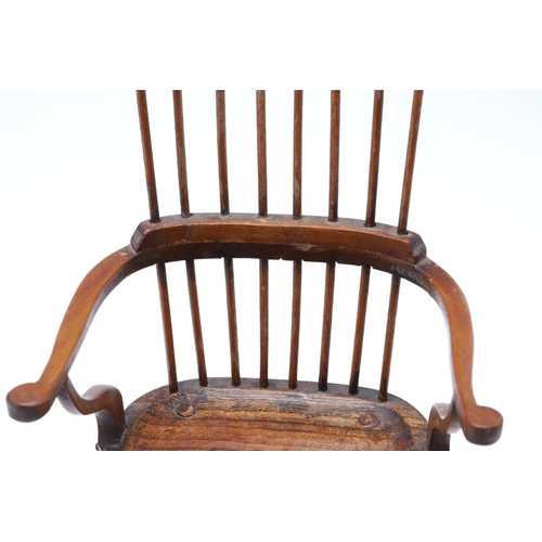 1178 - AN EARLY 20TH CENTURY MINIATURE WINDSOR ELBOW CHAIR. in the 19th century style, possibly sycamore, t... 