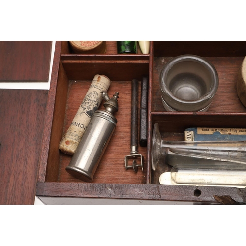 1191 - AN EARLY 19TH CENTURY MAHOGANY APOTHECARY BOX AND CONTENTS. the rectangular lift top box revealing a... 