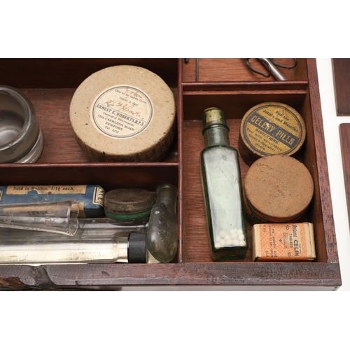 1191 - AN EARLY 19TH CENTURY MAHOGANY APOTHECARY BOX AND CONTENTS. the rectangular lift top box revealing a... 