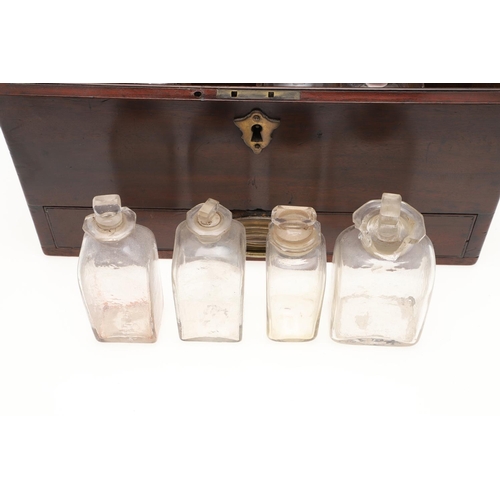 1191 - AN EARLY 19TH CENTURY MAHOGANY APOTHECARY BOX AND CONTENTS. the rectangular lift top box revealing a... 