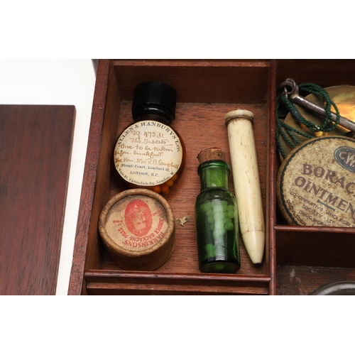 1191 - AN EARLY 19TH CENTURY MAHOGANY APOTHECARY BOX AND CONTENTS. the rectangular lift top box revealing a... 