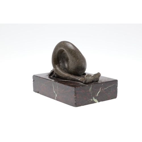 1192 - A 16TH CENTURY STYLE SERPENTINE MARBLE DESK WEIGHT. modelled as a mythical dolphin upon a mottled de... 