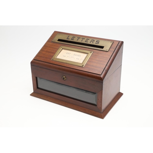 1198 - AN EDWARDIAN BRASS MOUNTED MAHOGANY LETTER BOX. the hinged lid with paper inset 'Post Leaves' times ... 