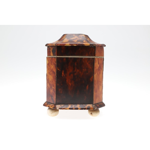 1201 - A GEORGE III TORTOISESHELL AND IVORY TEA CADDY. of octagonal casket form, the hinged lid enclosing t... 