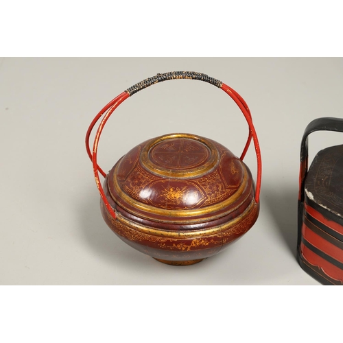 1202 - A 20TH CENTURY CHINESE RED AND GILT FOOD CONTAINER. of domed shape with double bamboo joined handle,... 