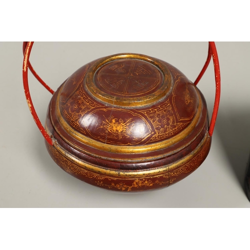 1202 - A 20TH CENTURY CHINESE RED AND GILT FOOD CONTAINER. of domed shape with double bamboo joined handle,... 