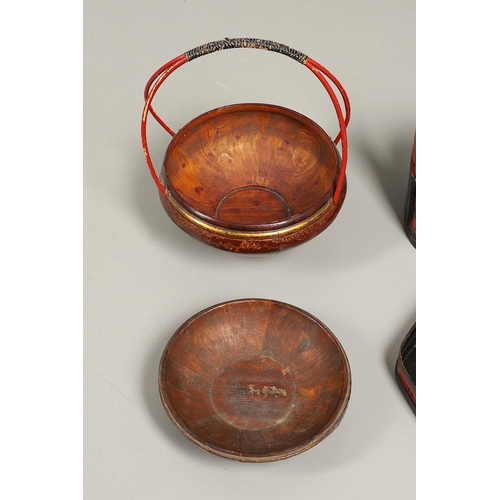 1202 - A 20TH CENTURY CHINESE RED AND GILT FOOD CONTAINER. of domed shape with double bamboo joined handle,... 