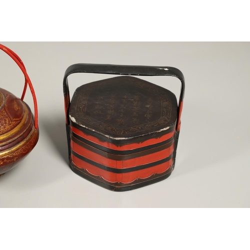 1202 - A 20TH CENTURY CHINESE RED AND GILT FOOD CONTAINER. of domed shape with double bamboo joined handle,... 