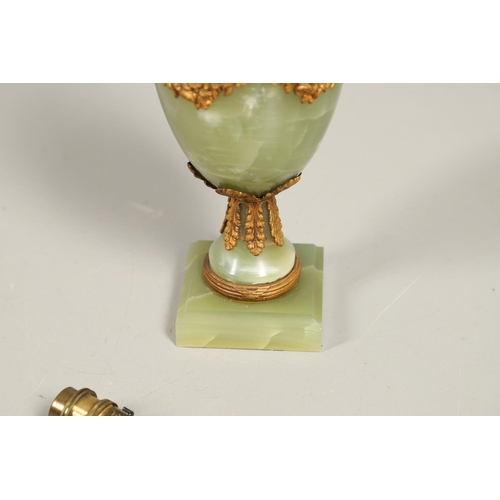 1205 - AN ONYX AND GILT METAL TABLE LAMP. of two handled Classical urn form with gilt metal leaf, floral an... 