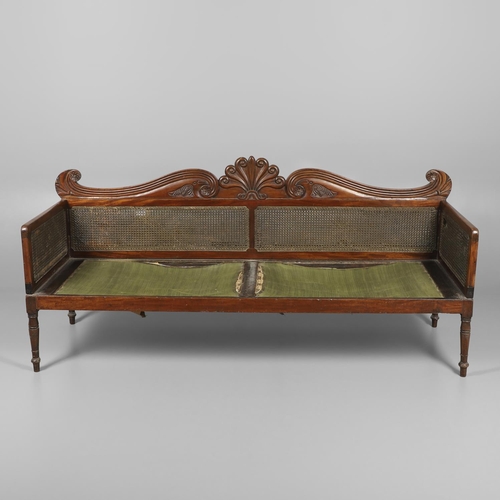 1207 - A REGENCY MAHOGANY CAMPAIGN SOFA. with carved scrolling crest rail and central multiple scroll 'fan'... 