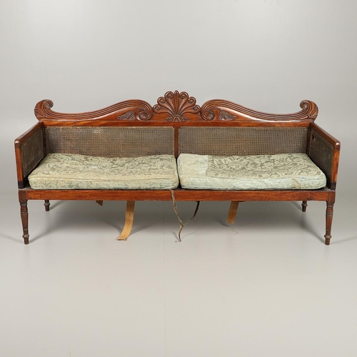 1207 - A REGENCY MAHOGANY CAMPAIGN SOFA. with carved scrolling crest rail and central multiple scroll 'fan'... 