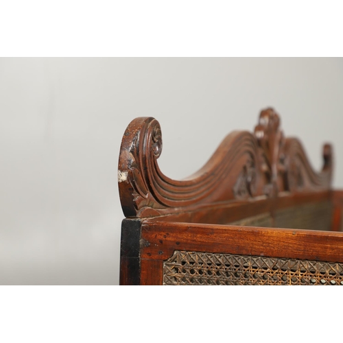 1207 - A REGENCY MAHOGANY CAMPAIGN SOFA. with carved scrolling crest rail and central multiple scroll 'fan'... 