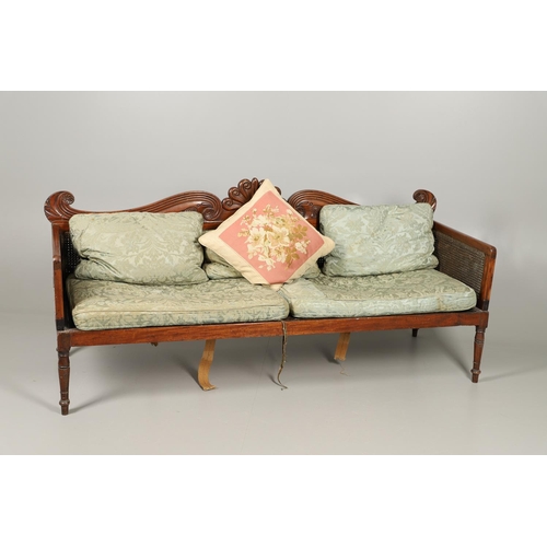 1207 - A REGENCY MAHOGANY CAMPAIGN SOFA. with carved scrolling crest rail and central multiple scroll 'fan'... 