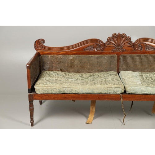 1207 - A REGENCY MAHOGANY CAMPAIGN SOFA. with carved scrolling crest rail and central multiple scroll 'fan'... 