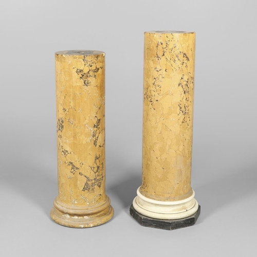 1209 - A PAIR OF YELLOW MARBLE SCAGLIOLA COLUMNS. the taller upon a turned white painted and octagonal ebon... 