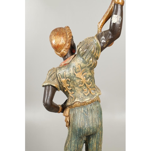 1210 - AN ITALIAN POLYCHROME PAINTED BLACKAMOOR TORCHERE. 20th century, modelled as a female, carved with t... 