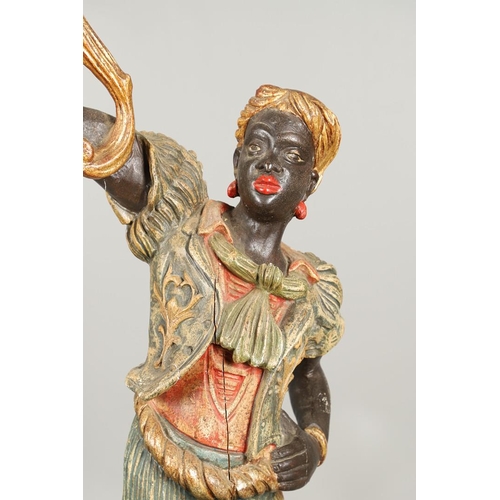 1210 - AN ITALIAN POLYCHROME PAINTED BLACKAMOOR TORCHERE. 20th century, modelled as a female, carved with t... 