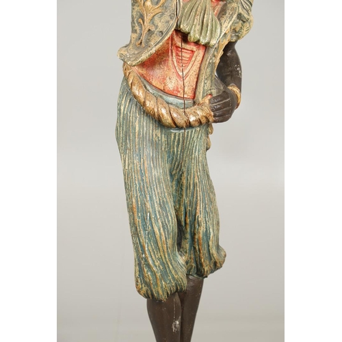 1210 - AN ITALIAN POLYCHROME PAINTED BLACKAMOOR TORCHERE. 20th century, modelled as a female, carved with t... 