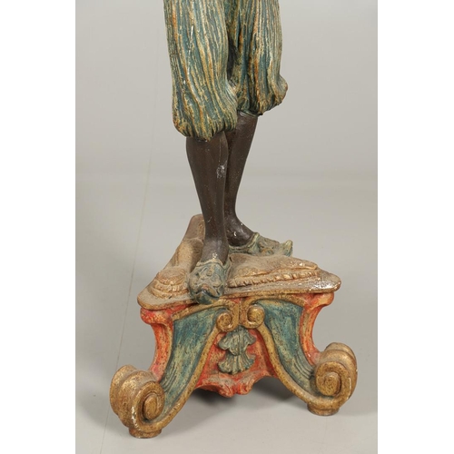 1210 - AN ITALIAN POLYCHROME PAINTED BLACKAMOOR TORCHERE. 20th century, modelled as a female, carved with t... 