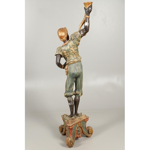 1210 - AN ITALIAN POLYCHROME PAINTED BLACKAMOOR TORCHERE. 20th century, modelled as a female, carved with t... 