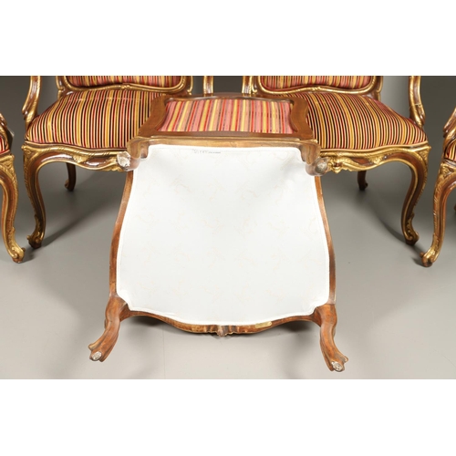 1212 - A SET OF SIX ITALIAN WALNUT AND PARCEL GILT OPEN ARMCHAIRS. by the contemporary designer and craftsm... 