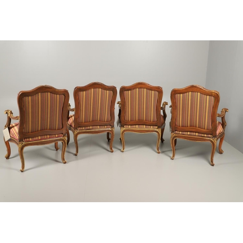 1212 - A SET OF SIX ITALIAN WALNUT AND PARCEL GILT OPEN ARMCHAIRS. by the contemporary designer and craftsm... 