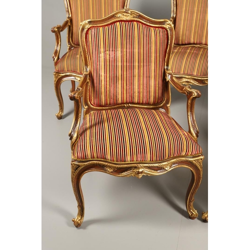 1212 - A SET OF SIX ITALIAN WALNUT AND PARCEL GILT OPEN ARMCHAIRS. by the contemporary designer and craftsm... 