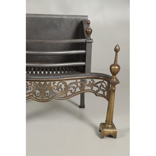 1215 - AN ADAMS STYLE CAST IRON AND BRASS FIRE BASKET. of serpentine form with wrought rear supports, pierc... 