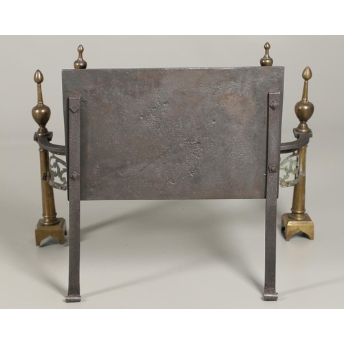 1215 - AN ADAMS STYLE CAST IRON AND BRASS FIRE BASKET. of serpentine form with wrought rear supports, pierc... 