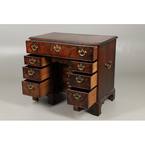 1216 - A GEORGE III MAHOGANY SECRETAIRE KNEEHOLE DESK. the moulded top above a secretaire section fitted wi... 