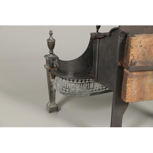 1217 - AN ADAMS STYLE CAST IRON FIRE BASKET. of serpentine form with pierced copper front, tapering square ... 