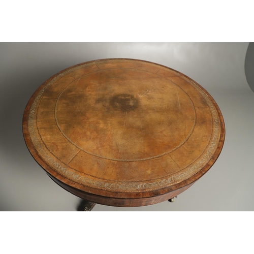 1221 - A REGENCY MAHOGANY CIRCULAR LIBRARY TABLE. the top with tooled leather insert, on a turned column an... 