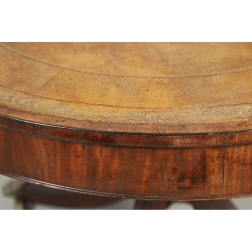 1221 - A REGENCY MAHOGANY CIRCULAR LIBRARY TABLE. the top with tooled leather insert, on a turned column an... 