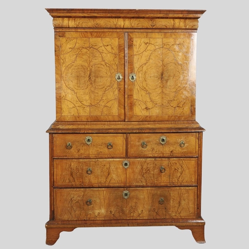 1222 - A GEORGE II WALNUT CABINET ON CHEST. the cabinet with moulded cornice above eleven fitted drawers to... 