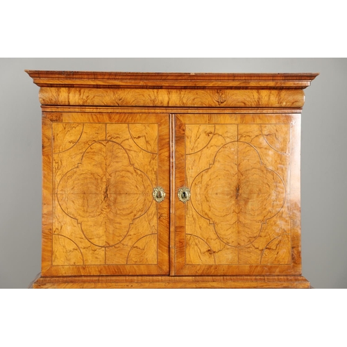 1222 - A GEORGE II WALNUT CABINET ON CHEST. the cabinet with moulded cornice above eleven fitted drawers to... 