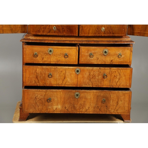 1222 - A GEORGE II WALNUT CABINET ON CHEST. the cabinet with moulded cornice above eleven fitted drawers to... 