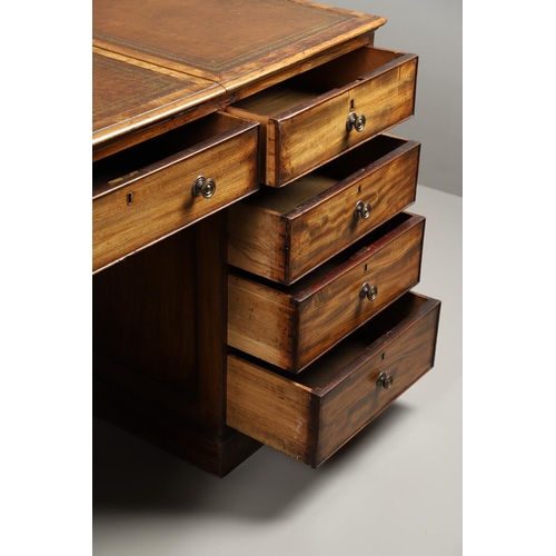 1227 - A 19TH CENTURY MAHOGANY PARTNERS DESK. the tooled and segmented leather top with central writing slo... 