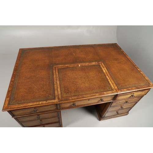 1227 - A 19TH CENTURY MAHOGANY PARTNERS DESK. the tooled and segmented leather top with central writing slo... 