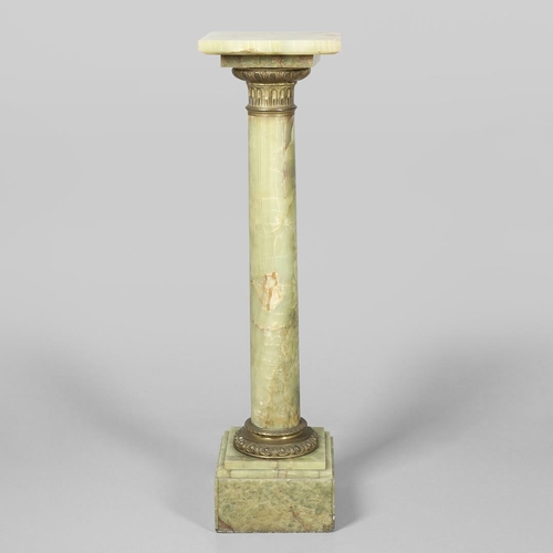 1228 - AN ONYX AND GILT METAL COLUMN JARDINIERE STAND. the cylindrical column with gilt metal mounts, cast ... 