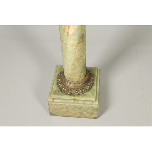 1228 - AN ONYX AND GILT METAL COLUMN JARDINIERE STAND. the cylindrical column with gilt metal mounts, cast ... 