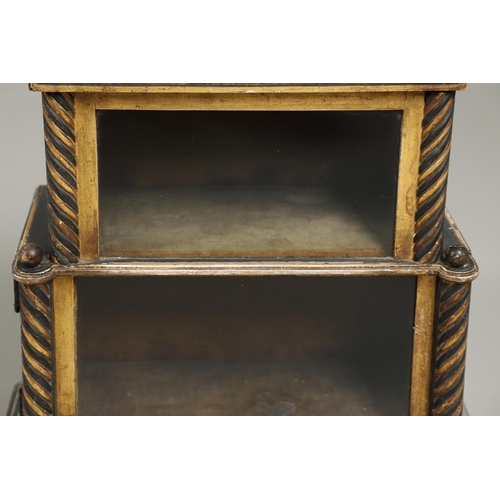 1229 - A VICTORIAN EBONISED AND GILDED CURIO TABLE CABINET. the tray top with ball finials and moulded figu... 