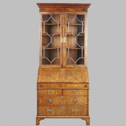 1232 - AN 18TH CENTURY WALNUT BUREAU BOOKCASE. the astrigal glazed top section enclosing three shelves, the... 