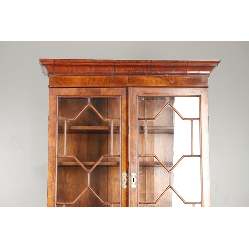 1232 - AN 18TH CENTURY WALNUT BUREAU BOOKCASE. the astrigal glazed top section enclosing three shelves, the... 