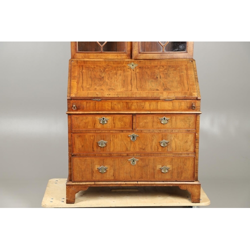 1232 - AN 18TH CENTURY WALNUT BUREAU BOOKCASE. the astrigal glazed top section enclosing three shelves, the... 