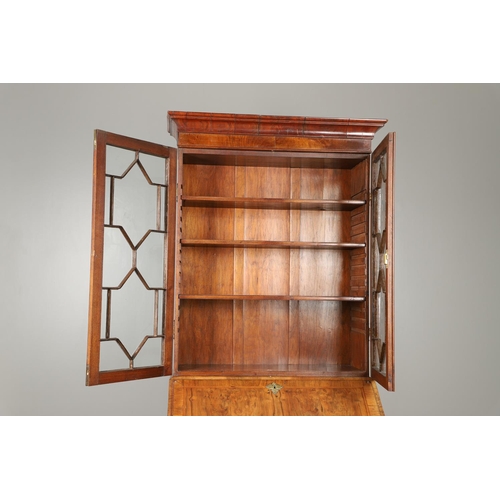 1232 - AN 18TH CENTURY WALNUT BUREAU BOOKCASE. the astrigal glazed top section enclosing three shelves, the... 