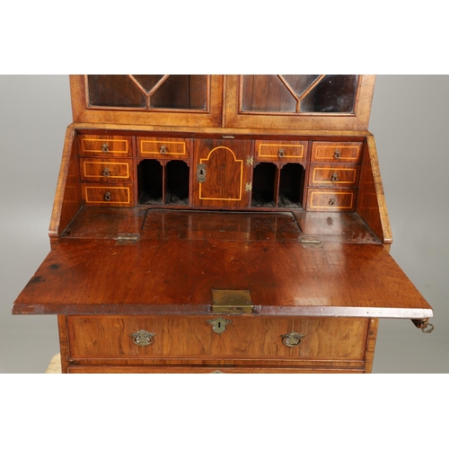 1232 - AN 18TH CENTURY WALNUT BUREAU BOOKCASE. the astrigal glazed top section enclosing three shelves, the... 