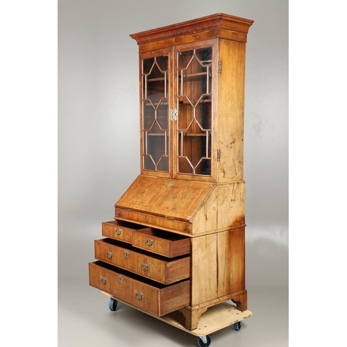 1232 - AN 18TH CENTURY WALNUT BUREAU BOOKCASE. the astrigal glazed top section enclosing three shelves, the... 