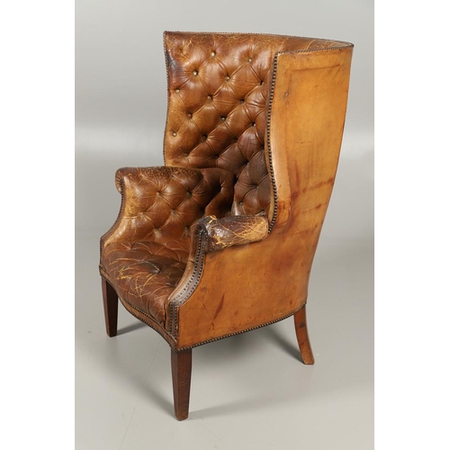 1233 - A GEORGE III STYLE LEATHER WINGBACK ARMCHAIR. with high back, serpentine seat and scroll arms, the b... 