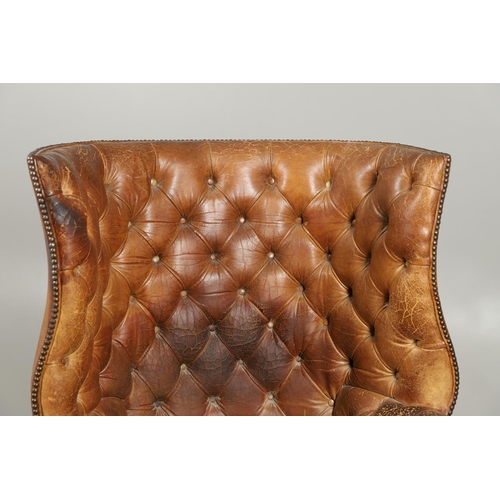 1233 - A GEORGE III STYLE LEATHER WINGBACK ARMCHAIR. with high back, serpentine seat and scroll arms, the b... 